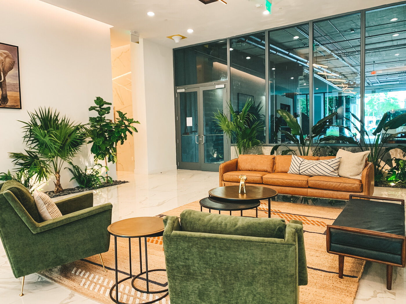 Lobby lounge with leather seating and tropical plants
