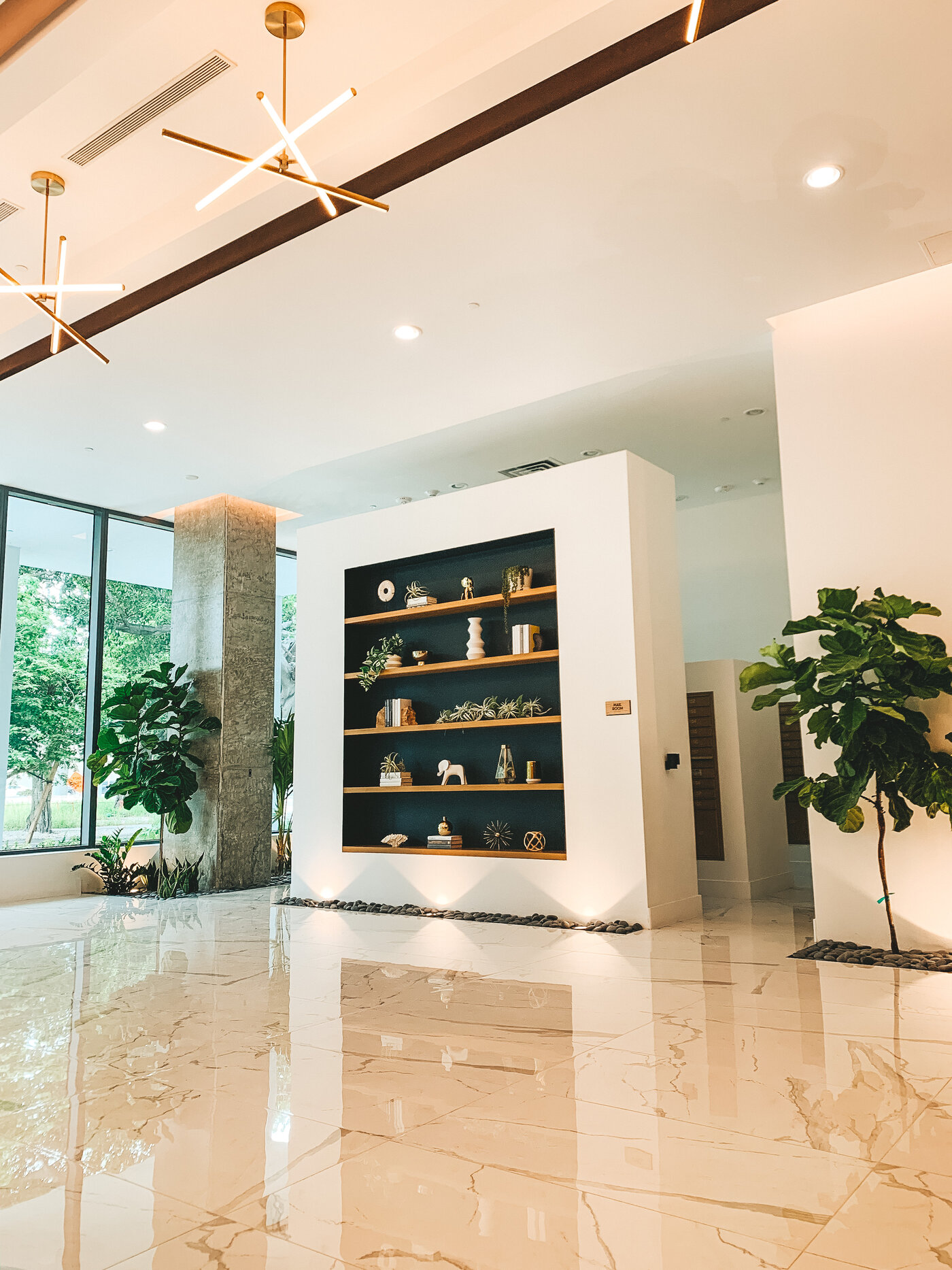 Lobby display shelves and modern ceiling fixtures